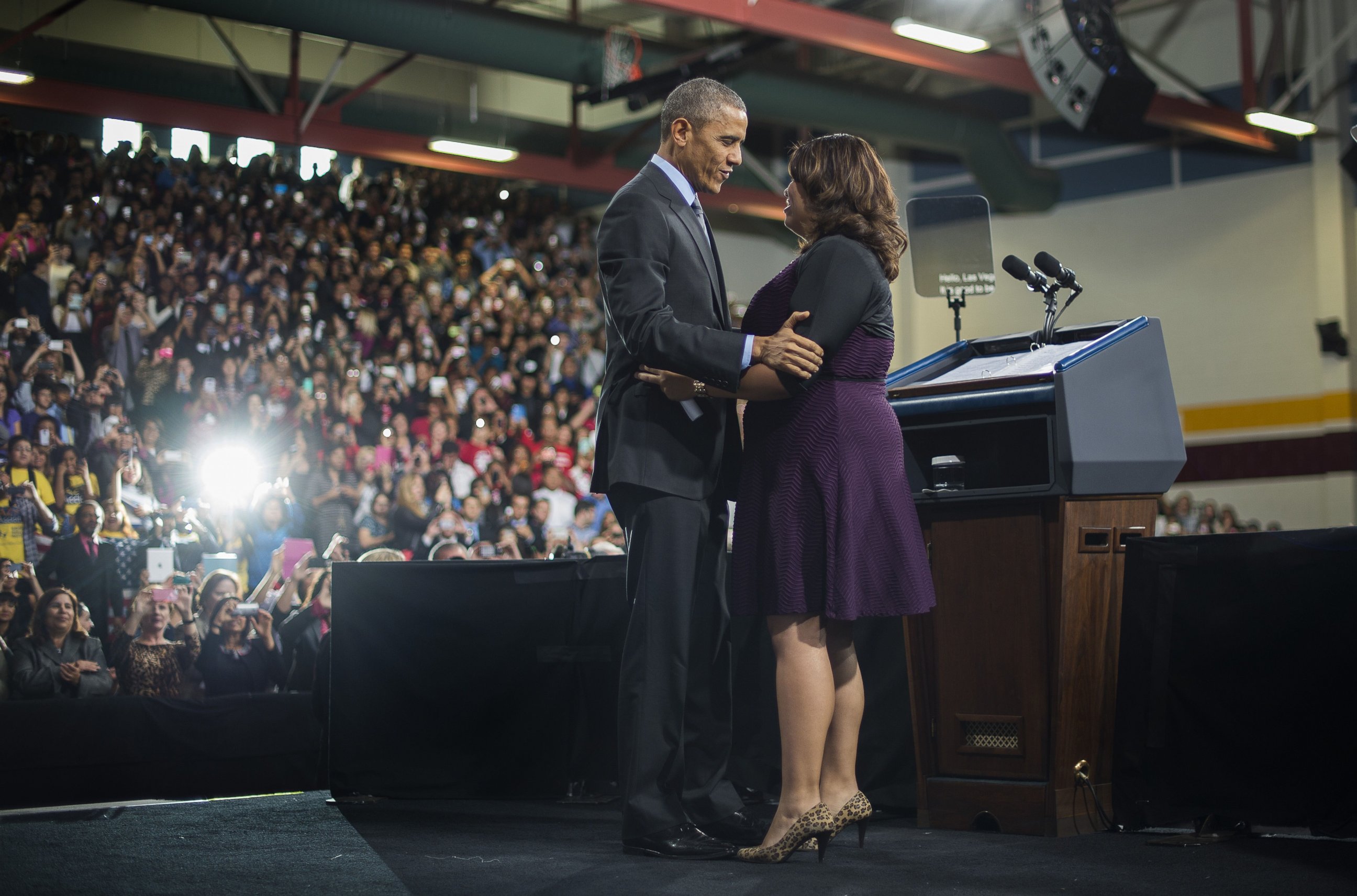PHOTO: President Barack Obama hugs Astrid Silva, an activist, as he arrives to deliver remarks on the new steps he will be taking within his executive authority on immigration at Del Sol High School in Las Vegas, Nov. 21, 2014.