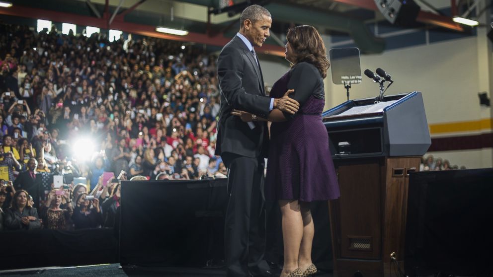PHOTO: President Barack Obama hugs Astrid Silva, an activist, as he arrives to deliver remarks on the new steps he will be taking within his executive authority on immigration at Del Sol High School in Las Vegas, Nov. 21, 2014.