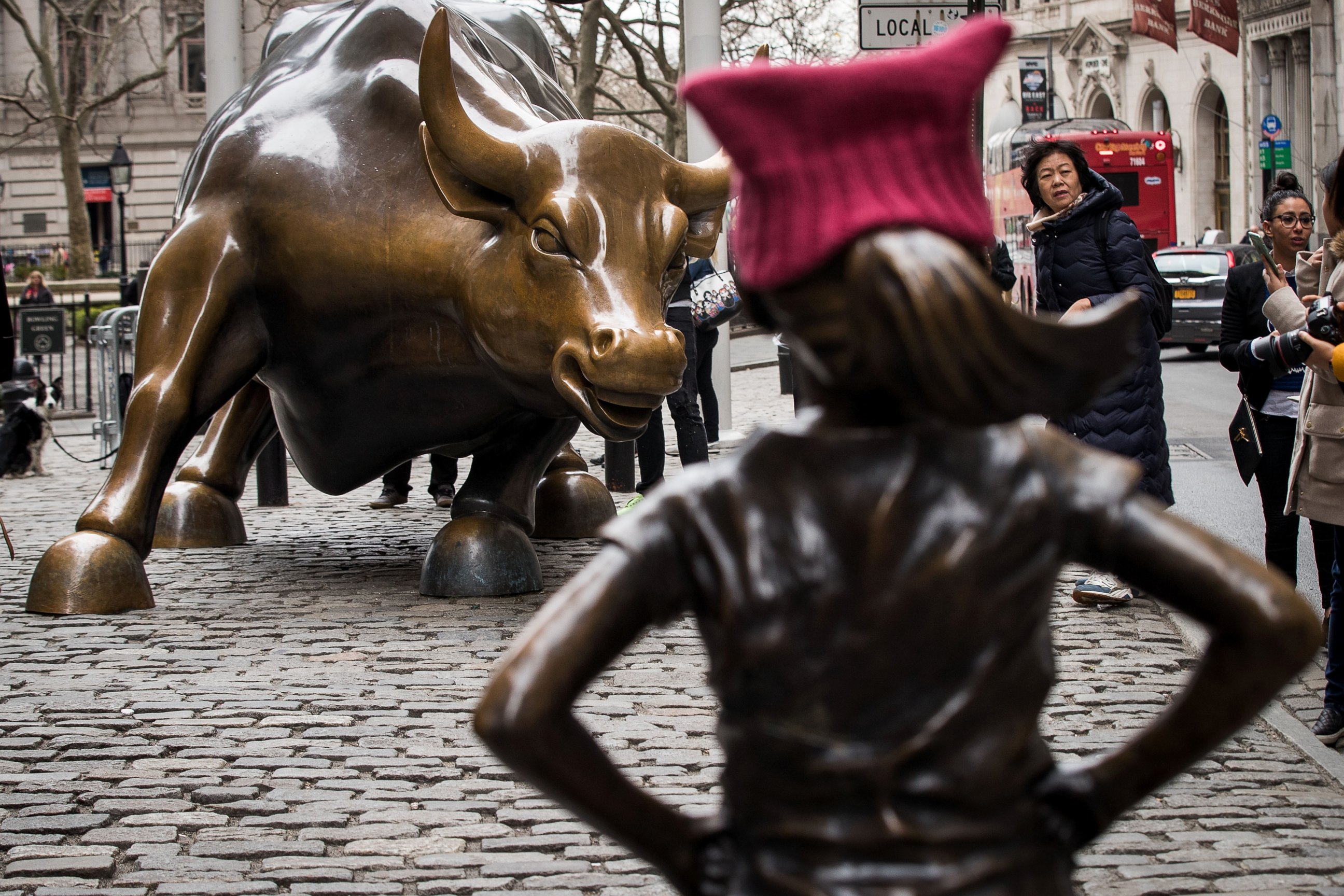 PHOTO: 'The Fearless Girl' statues stands across from the iconic Wall Street charging bull statue, March 8, 2017, in New York.