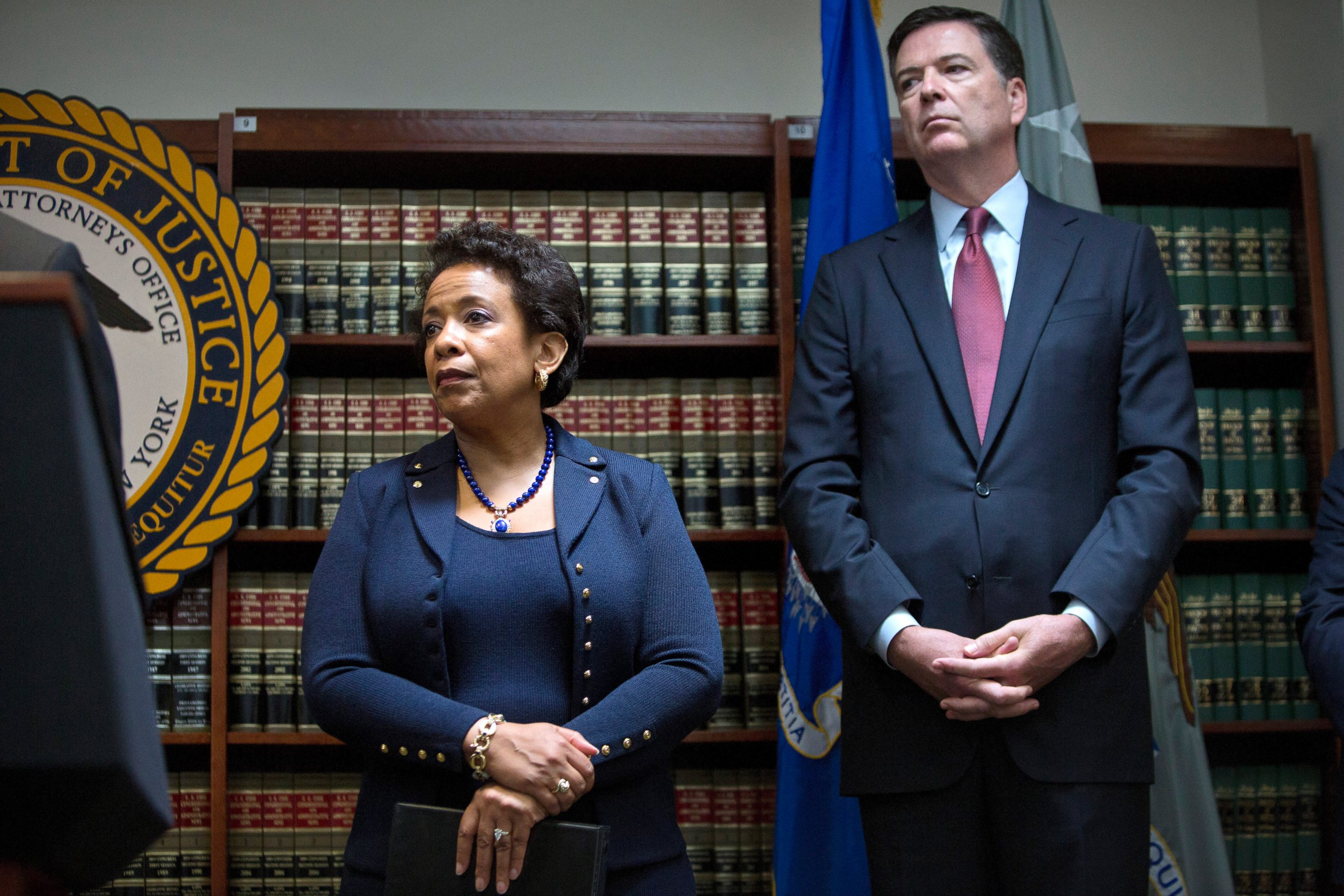 PHOTO: James Comey, director of the Federal Bureau of Investigation (FBI), right, and Loretta Lynch, U.S. attorney general, listen during a news conference, May 27, 2015. 