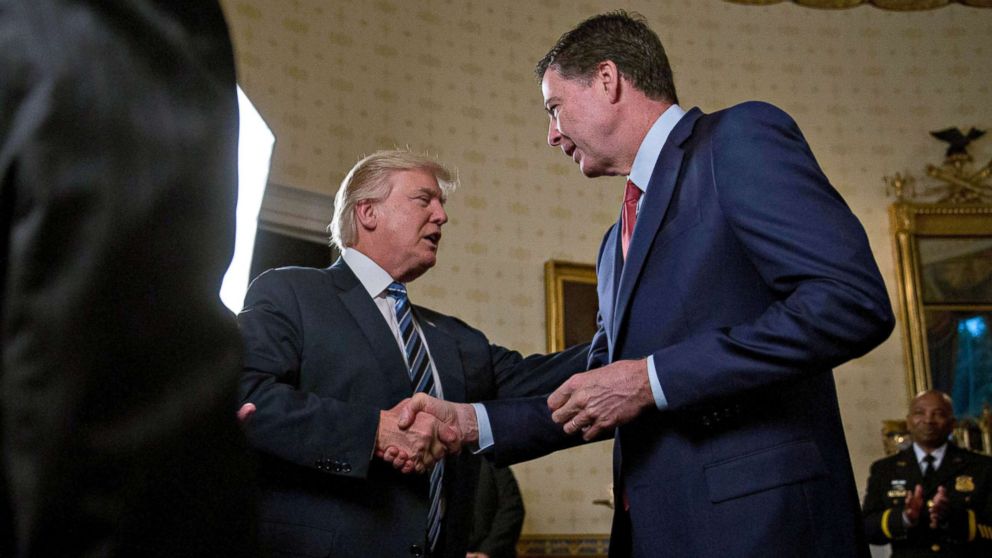 PHOTO: President Donald Trump shakes hands with James Comey, director of the Federal Bureau of Investigation (FBI), during an Inaugural Law Enforcement Officers and First Responders Reception at the White House, Jan. 22, 2017.
