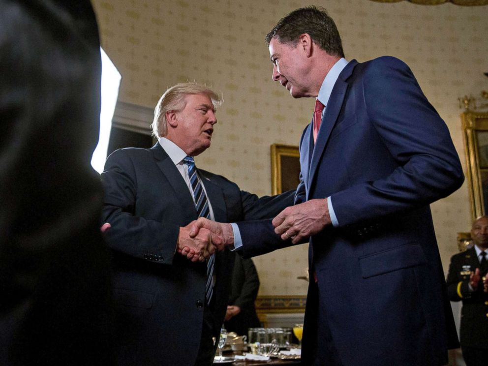 PHOTO: President Donald Trump shakes hands with James Comey, director of the Federal Bureau of Investigation (FBI), during an Inaugural Law Enforcement Officers and First Responders Reception at the White House, Jan. 22, 2017.