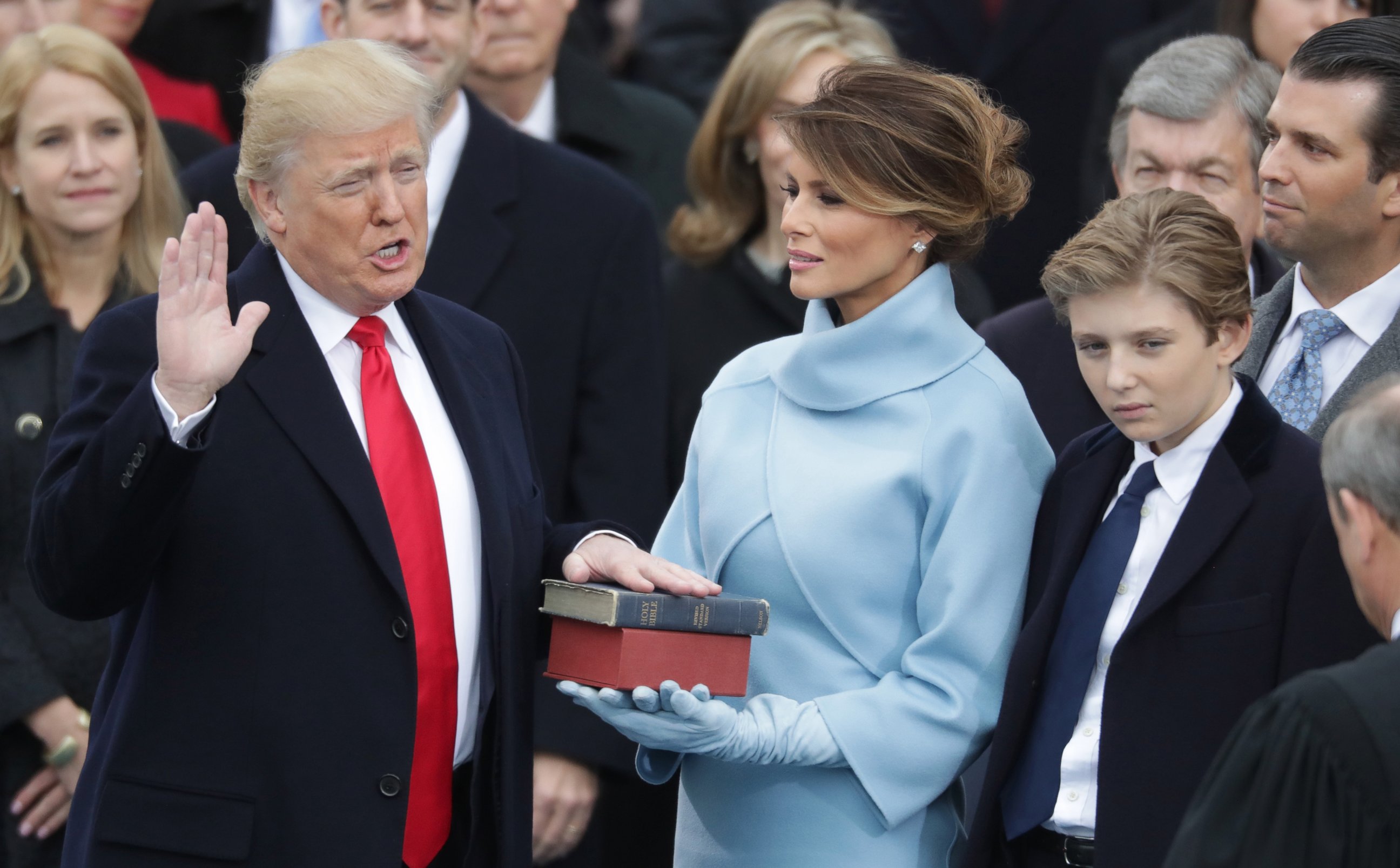 PHOTO: (L-R) President Donald Trump takes the oath of office as his wife Melania Trump holds the bible and his son Barron Trump looks on, on the West Front of the U.S. Capitol, Jan. 20, 2017 in Washington, D.C. 