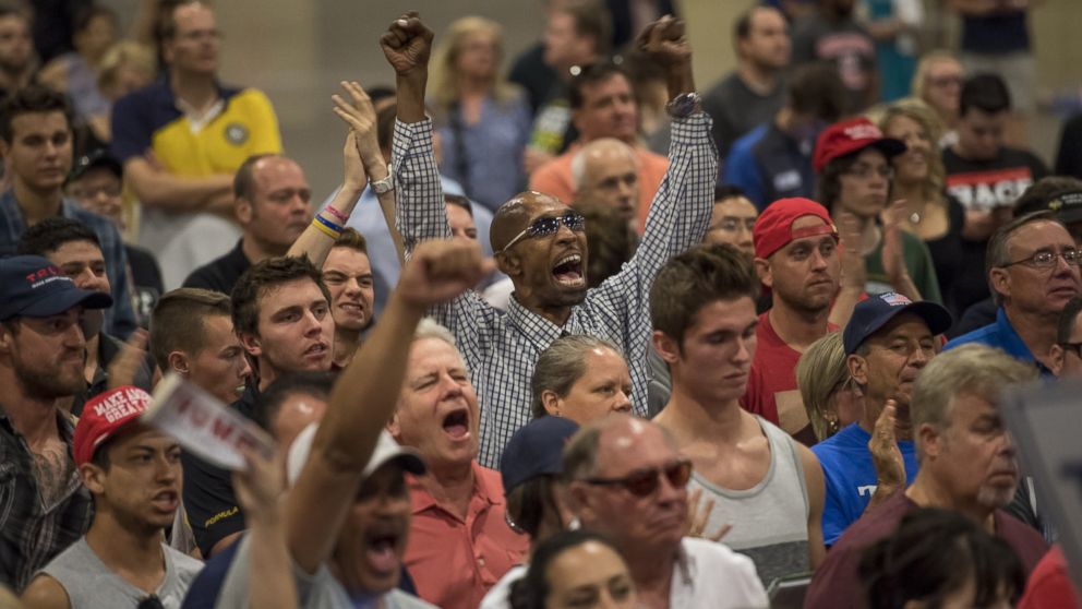 Attendees cheer as Donald Trump, 2016 Republican presidential nominee, not pictured, speaks during a campaign event in Phoenix, Arizona, Aug. 31, 2016.