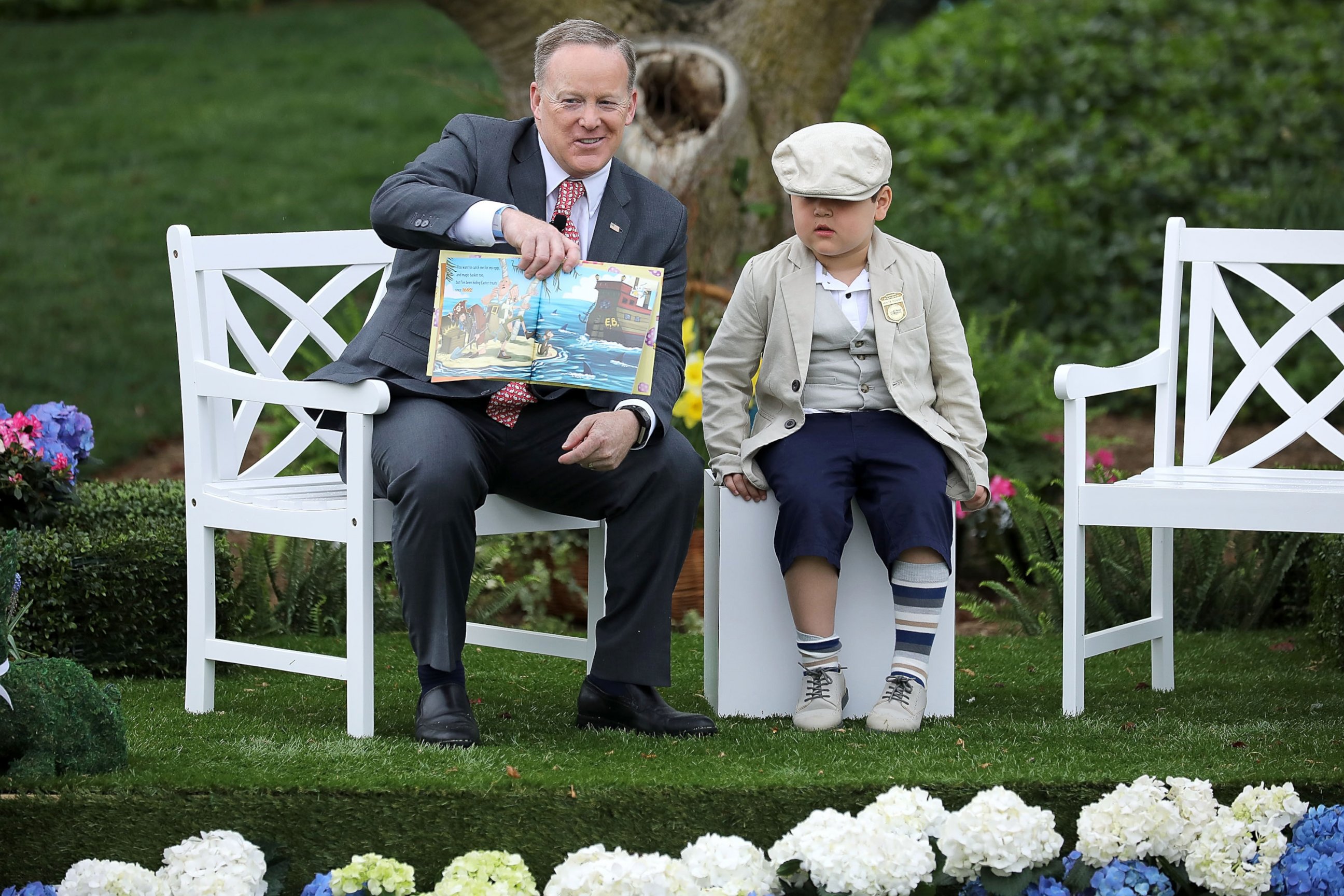 PHOTO: White House press secretary Sean Spicer reads the childrens' book "How To Catch The Easter Bunny" during the 139th Easter Egg Roll on the South Lawn of the White House, April 17, 2017, in Washington.