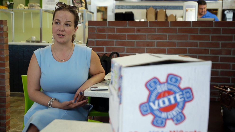 PHOTO: Christina Hernandez, an official with Organize Now, spends time at the Valisa Bakery to register voters in Orlando, Florida, Oct. 4, 2016. 