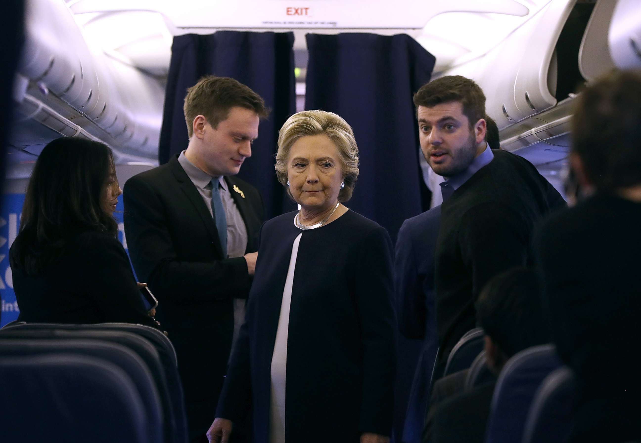 PHOTO: Democratic presidential nominee former Secretary of State Hillary Clinton talks with members of her staff aboard her campaign plane at Westchester County Airport, Nov. 4, 2016 in White Plains, New York. 