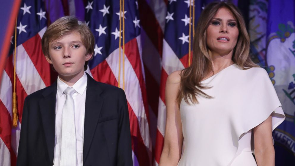 Barron Trump and his mother Melania Trump stand on stage after Republican president-elect Donald Trump delivered his acceptance speech at the New York Hilton Midtown in the early morning hours of Nov. 9, 2016 in New York City.