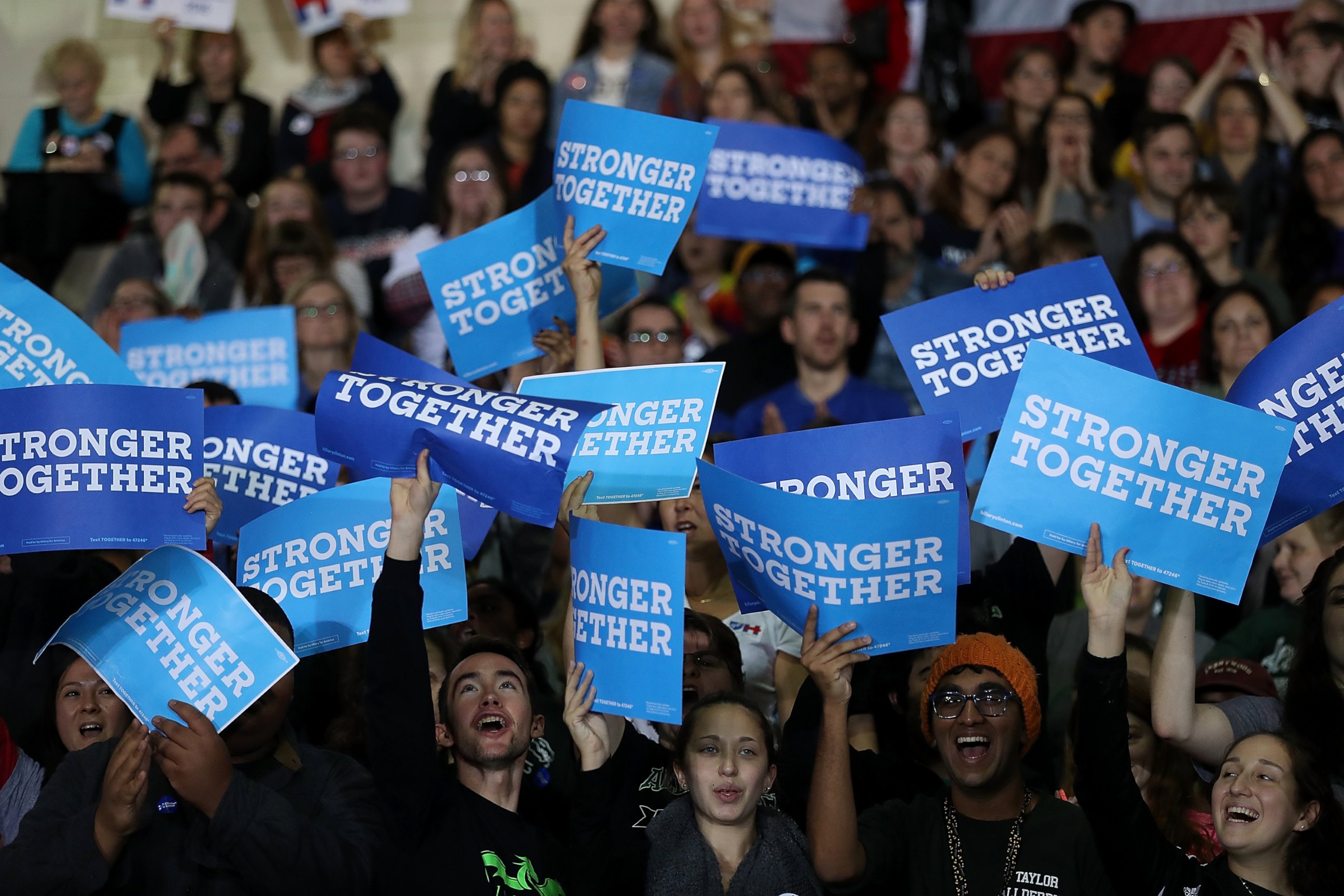 PHOTO: Supporters hold signs as democratic presidential nominee former Secretary of State Hillary Clinton speaks during a campaign rally at Taylor Allderdice High School, Oct. 22, 2016 in Pittsburgh, Pennsylvania.