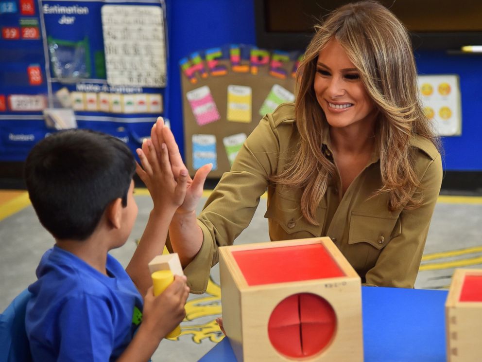 PHOTO: First Lady Melania Trump shares a laugh with a child during a visit to the American International School in the Saudi capital Riyadh, May 21, 2017. 