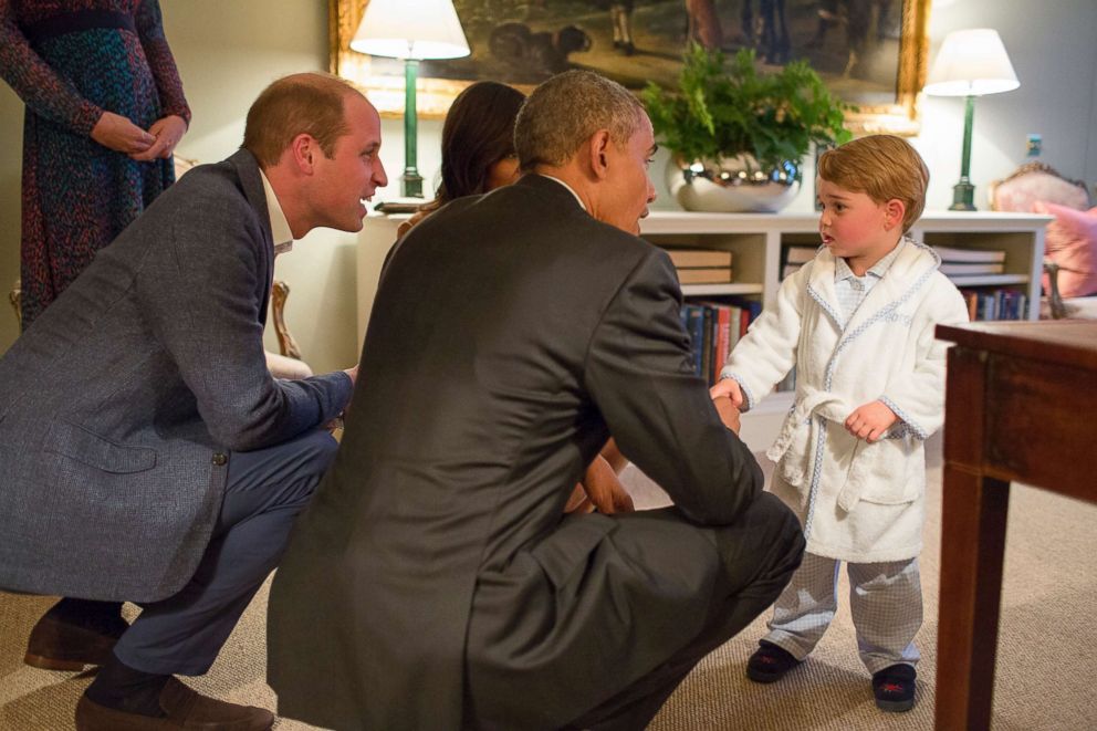 PHOTO: In this White House handout photo, President Barack Obama, Prince William, Duke of Cambridge and First Lady Michelle Obama talk with Prince George at Kensington Palace on April 22, 2016 in London.