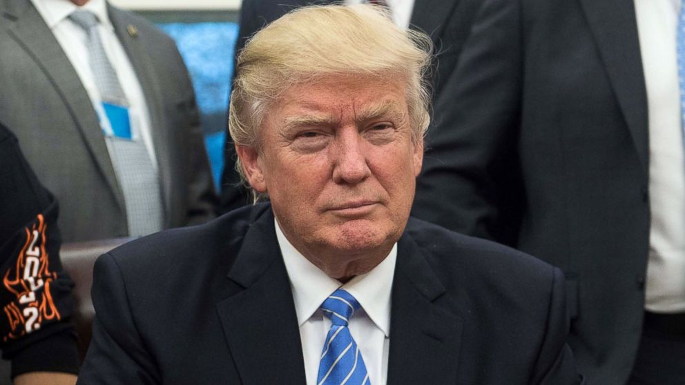 President Donald Trump poses with labor leaders, Jan. 23, 2017, in the Oval Office at the White House in Washington.