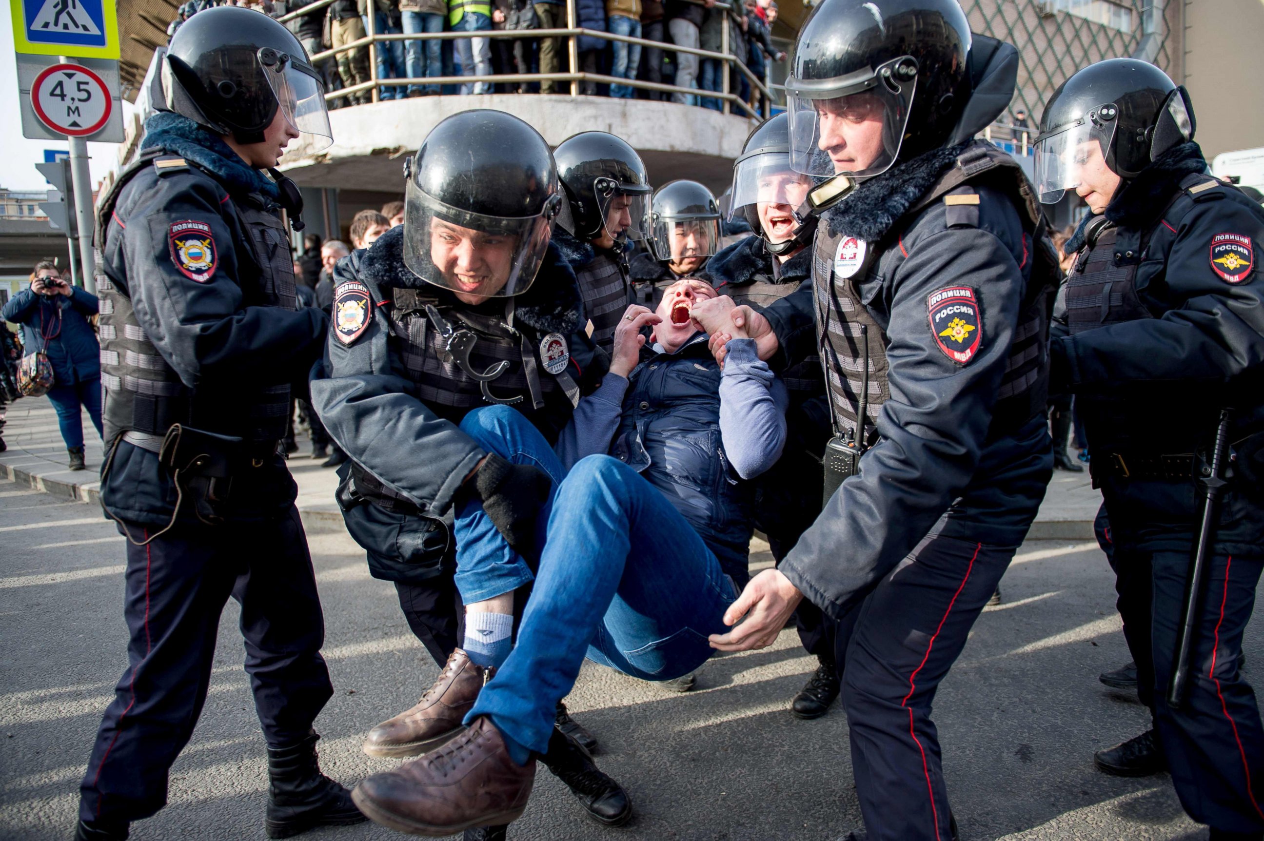 PHOTO: Riot police officers detain a protester during a rally in central Moscow, March 26, 2017.