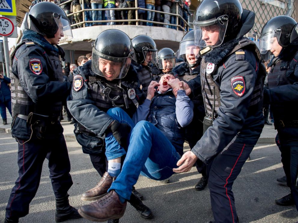 PHOTO: Riot police officers detain a protester during a rally in central Moscow, March 26, 2017.