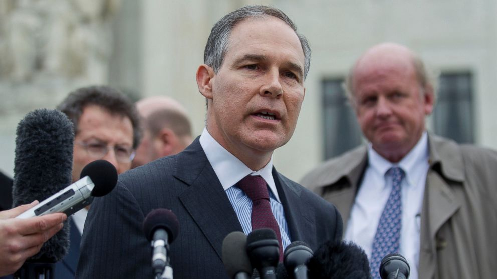 Scott Pruitt, attorney general of Oklahoma, center, speaks to the media in front of the U.S. Supreme Court, March 4, 2015.