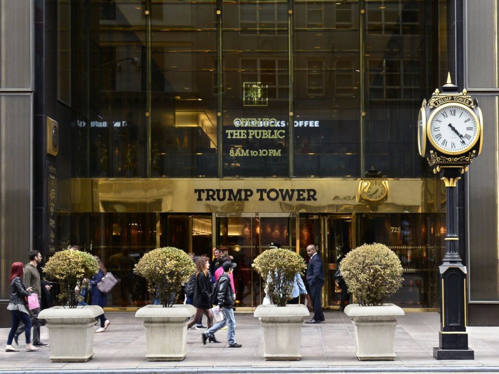 PHOTO: New York City shoppers and visitors walk past the entrance to Trump Tower on Fifth Avenue in New York, April 26, 2015.