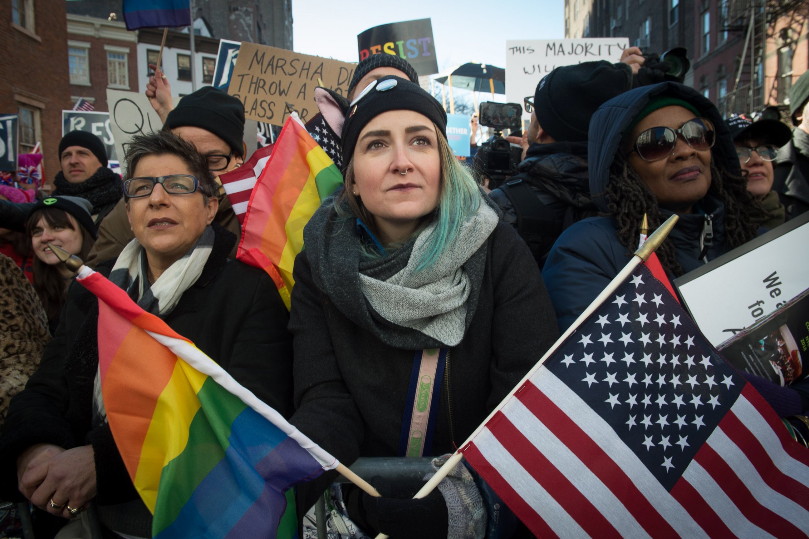 PHOTO: People hold signs and flags at a rally in front of the Stonewall Inn in solidarity with immigrants, asylum seekers, refugees, and the LGBT, Feb. 4, 2017 in New York.