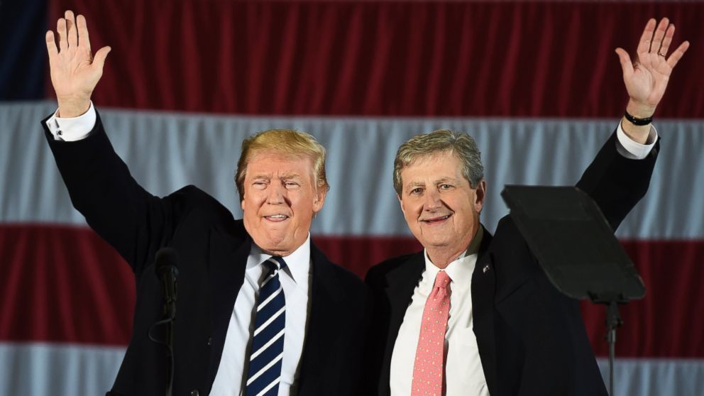President-elect Donald Trump and Louisiana Treasurer and Republican Senate candidate John Kennedy wave at a get-out-the-vote rally, Dec. 9, 2016, in Baton Rouge, Louisiana. 