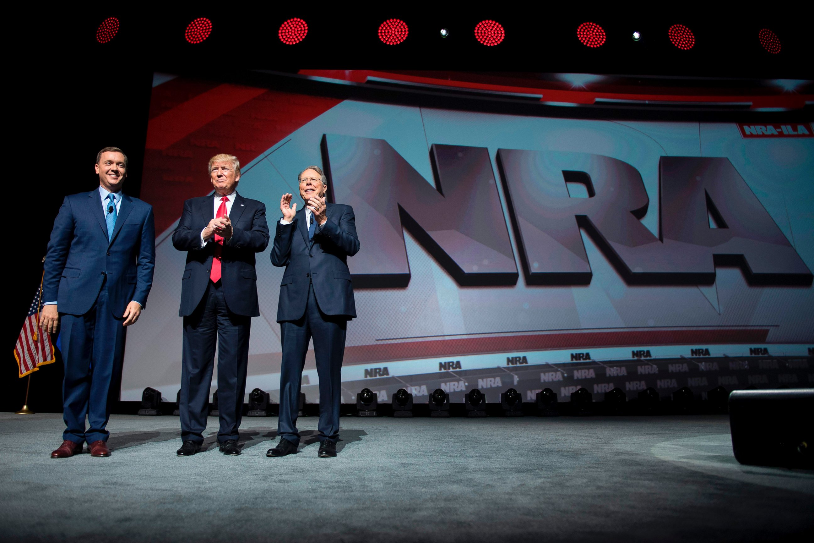 PHOTO: Donald Trump stands with National Rifle Association (NRA) President Wayne LaPierre, right, and NRA-ILA Executive Director Chris Cox during the NRA Leadership Forum in Atlanta, Georgia, April 28, 2017. 