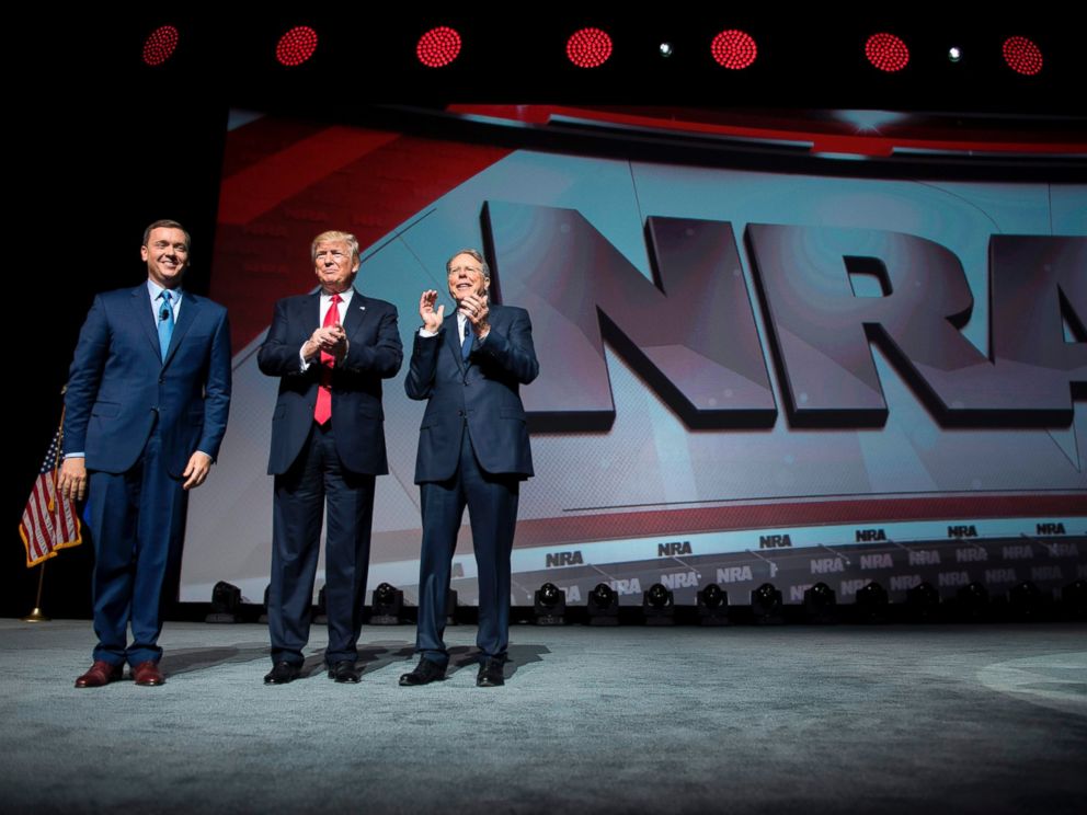 PHOTO: Donald Trump stands with National Rifle Association (NRA) President Wayne LaPierre, right, and NRA-ILA Executive Director Chris Cox during the NRA Leadership Forum in Atlanta, Georgia, April 28, 2017.
