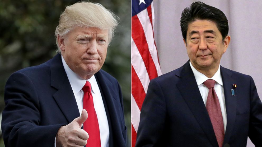 President Donald Trump gives a thumbs-up to members of the news media before boarding Marine One and departing the White House, Feb. 3, 2017, in Washington. Japanese Prime Minister Shinzo Abe meets media reporters following a meeting with President-elect Donald Trump, Nov. 17, 2016, in New York City. 