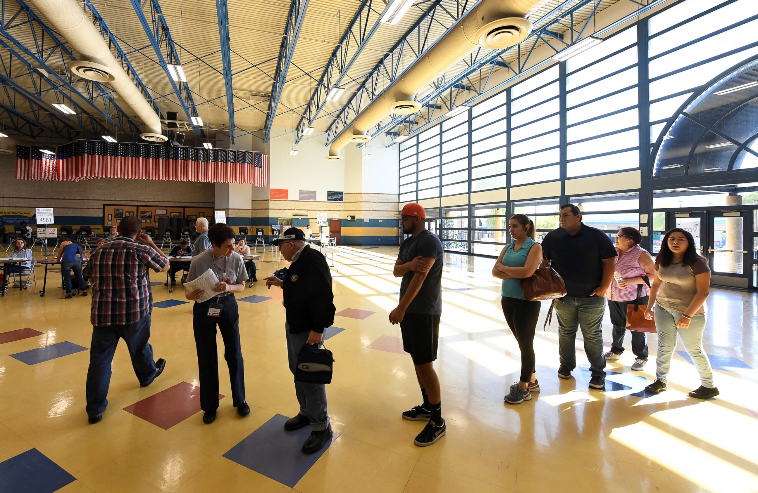 PHOTO: Voters are greeted at Cheyenne High School as they arrive to cast their ballots on Election Day, Nov. 8, 2016, in North Las Vegas, Nevada.