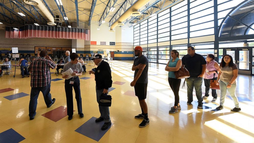 PHOTO: Voters are greeted at Cheyenne High School as they arrive to cast their ballots on Election Day, Nov. 8, 2016, in North Las Vegas, Nevada.
