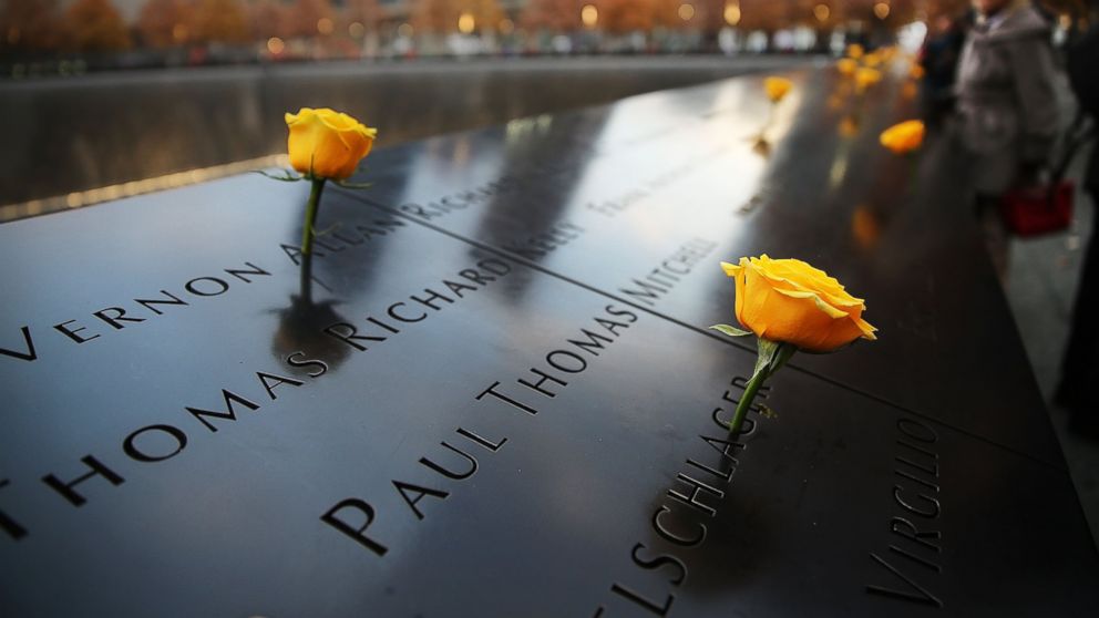 Flowers adorn the 9/11 Memorial for Veterans Day on Nov. 11, 2014 in New York City. 