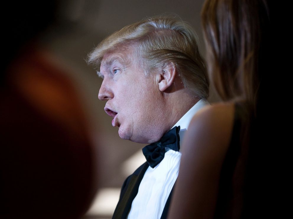 PHOTO: Donald Trump talks with other guests at the White House Correspondents Association dinner in Washington, April 30, 2011.