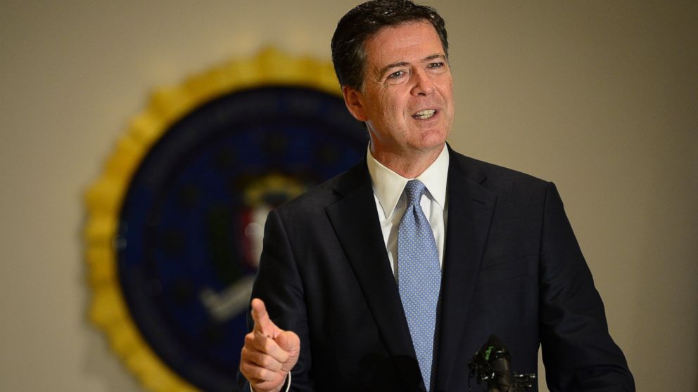FBI Director James Comey answers questions from the media during a press conference, July 23, 2015 at the FBI Denver Field Office in Denver.