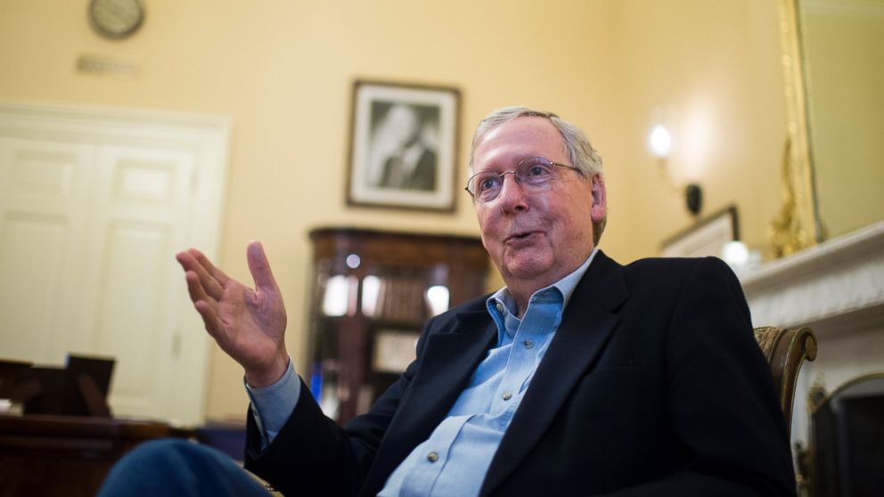 Senate Majority Leader Mitch McConnell speaks with reporters in his office in the U.S. Capitol, Dec. 11, 2015, in Washington. 