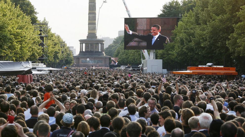 PHOTO: Democratic presidential hopeful, Barack Obama, seen on large TV screens, makes a speech in front of the Victory Column in Berlin on July 24, 2008. 