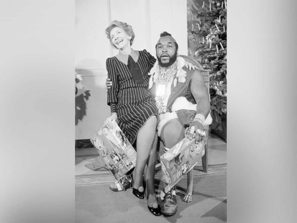 PHOTO: First Lady Nancy Reagan sits on the lap of television personality Mr. T. on Dec. 12, 1983 in Washington.