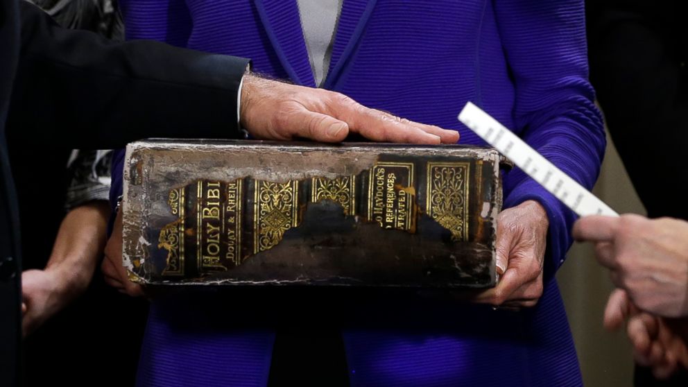 US Vice President Joe Biden (L) places his hand on the Biden family Bible held by his wife Jill Biden as he takes the oath of office from Supreme Court Justice Sonia Sotomayo during and official ceremony at the Naval Observatory on Jan. 20, 2013 in Washington.     