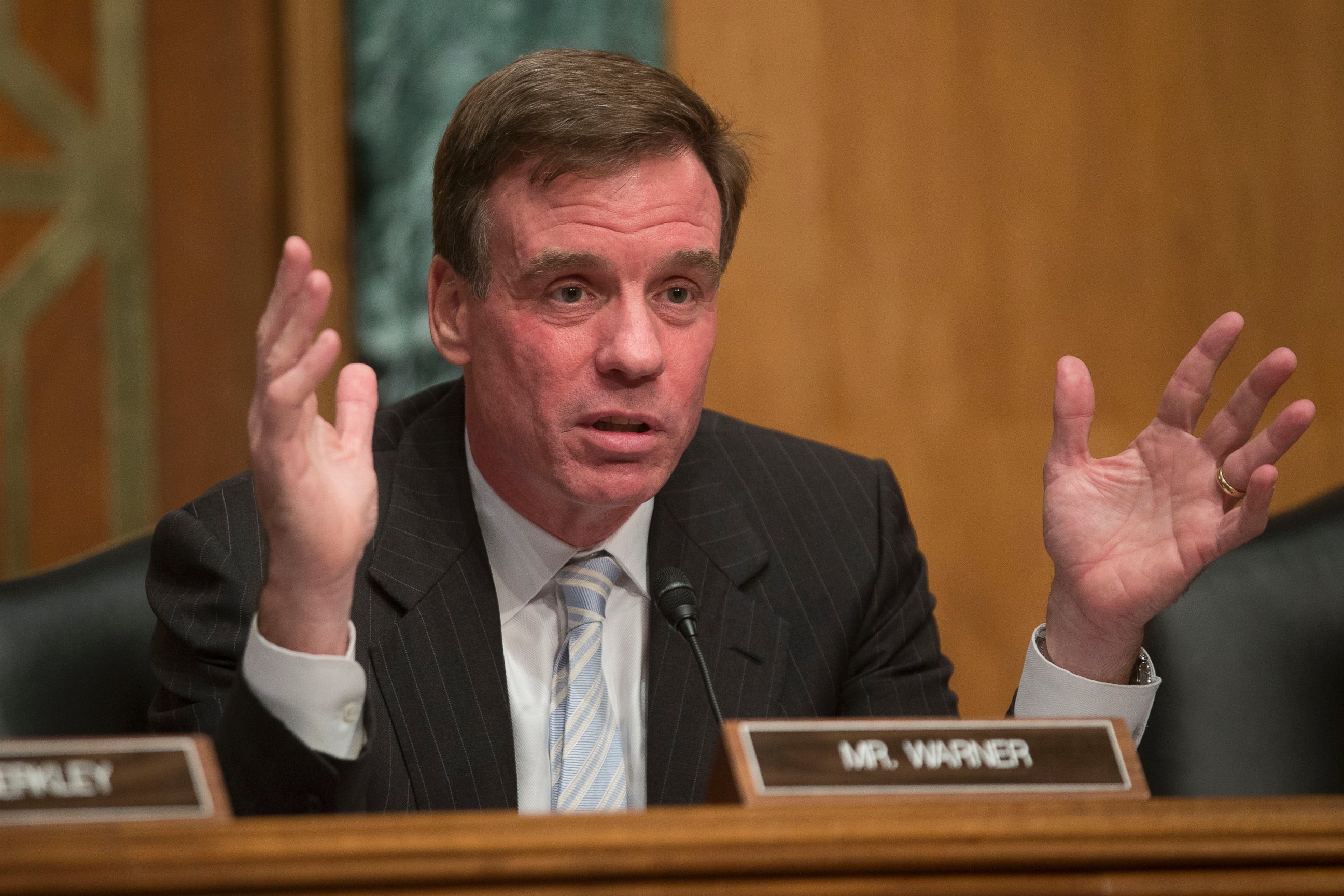 PHOTO: Senator Mark Warner, a Democrat from Virginia and chairman of the Senate Banking Subcommittee on National Security and International Trade and Finance, makes an opening statement, Nov. 19, 2013, in Washington.