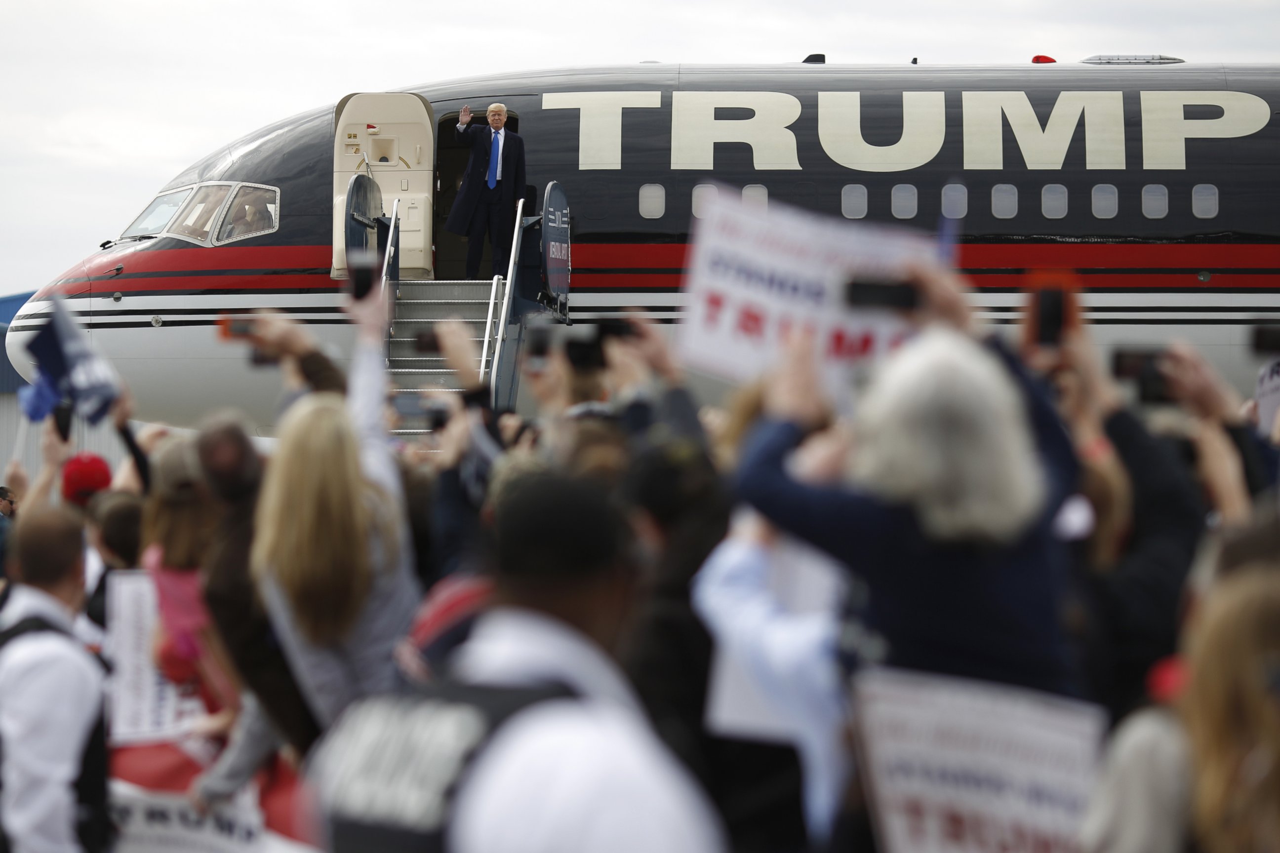 PHOTO: Republican presidential candidate Donald Trump waves to attendees while disembarking from his airplane at a campaign event in Dayton, Ohio, U.S., March 12, 2016. 