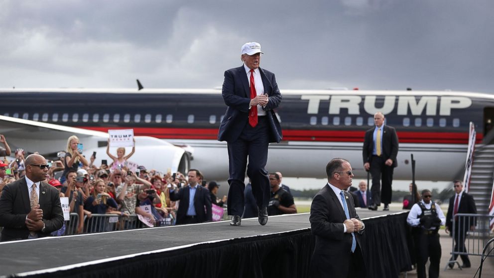 Republican presidential candidate Donald Trump takes to the stage to speak during a campaign rally at the Lakeland Linder Regional Airport on October 12, 2016 in Lakeland, Florida.