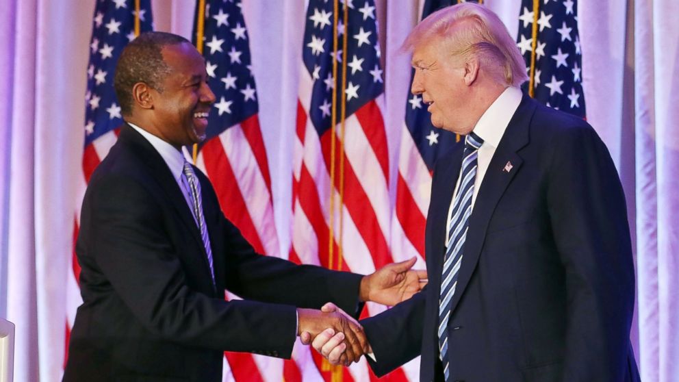 Republican presidential candidate Donald Trump shakes hands with former presidential candidate Ben Carson as he receives his endorsement at the Mar-A-Lago Club on March 11, 2016 in Palm Beach, Florida. 