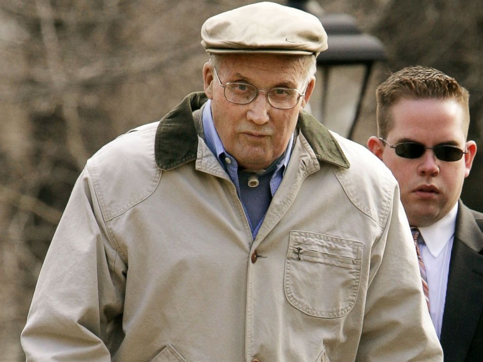 PHOTO: William Rehnquist leaves his house March 21, 2005 in Arlington, Virginia with a member of his security detail.
