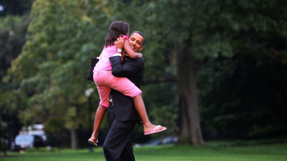PHOTO: President Barack Obama is welcomed home by daughter Sasha on the South lawn of the White House in Washington, Sept. 15, 2009. 