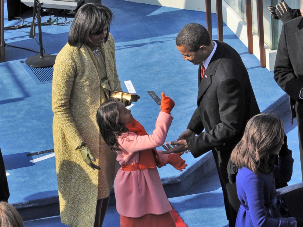 PHOTO: Sasha Obama gives her father a thumbs up after he takes the oath of office, Jan. 20, 2009. Her mother, Michelle, is at left and her sister, Malia, is at right.