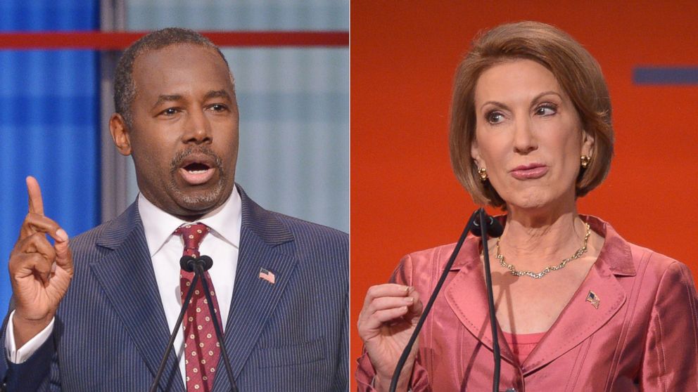 Retired neurosurgeon Ben Carson speaks during the prime time Republican presidential debate on Aug. 6, 2015 at the Quicken Loans Arena in Cleveland, Ohio. | Republican presidential hopeful Carly Fiorina speaks during the Republican presidential primary debate on Aug. 6, 2015 at the Quicken Loans Arena in Cleveland, Ohio. 