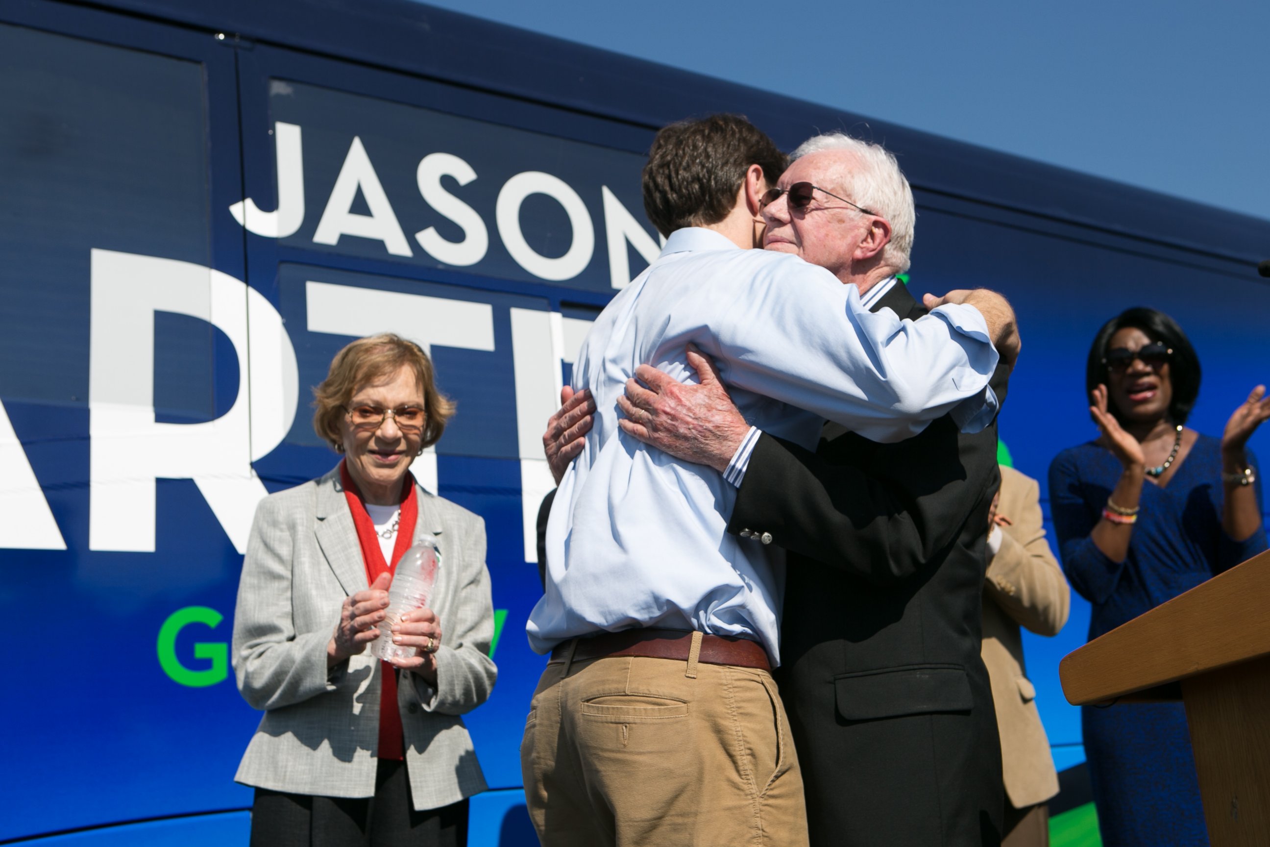 PHOTO: Jason Carter hugs his grandfather, former U.S. President Jimmy Carter, as former first lady Rosalynn Carter, left, looks on in Columbus, Ga. on Oct. 27, 2014.