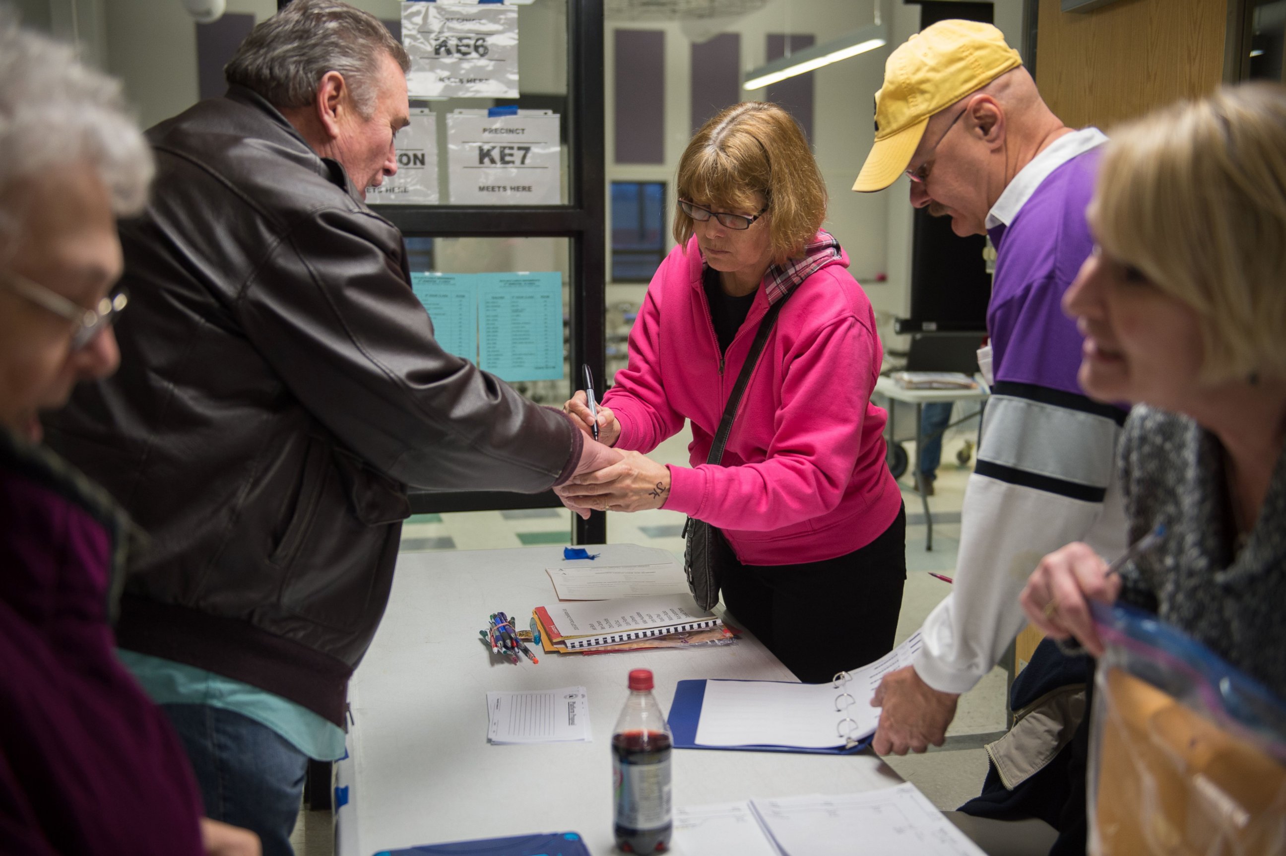 PHOTO: Caucus workers check-in voters prior the Republican Party Caucus at Keokuk High School, Feb, 1, 2016 in Keokuk, Iowa. 