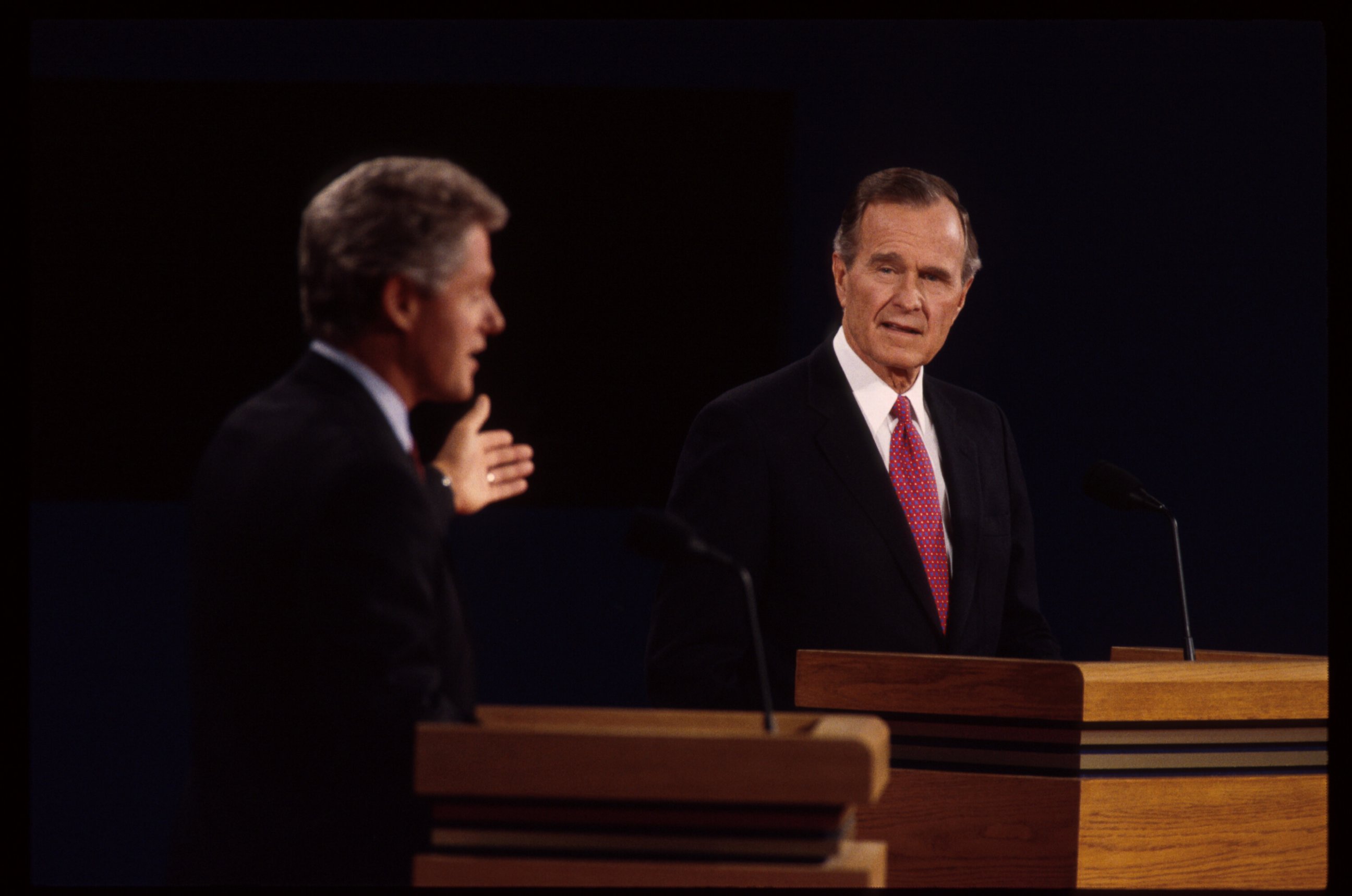 PHOTO: Bill Clinton and George H.W. bush are seen here at a presidential debate, Oct. 19, 1992, in East Lansing, Mich. 