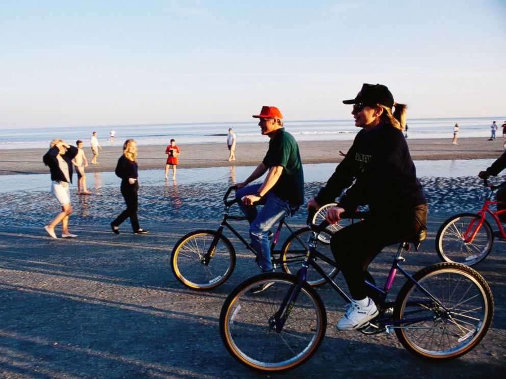 PHOTO:In this undated file photo Bill Clinton and Hillary Rodham Clinton ride bicycles along the beach at Hilton Head in South Carolina.