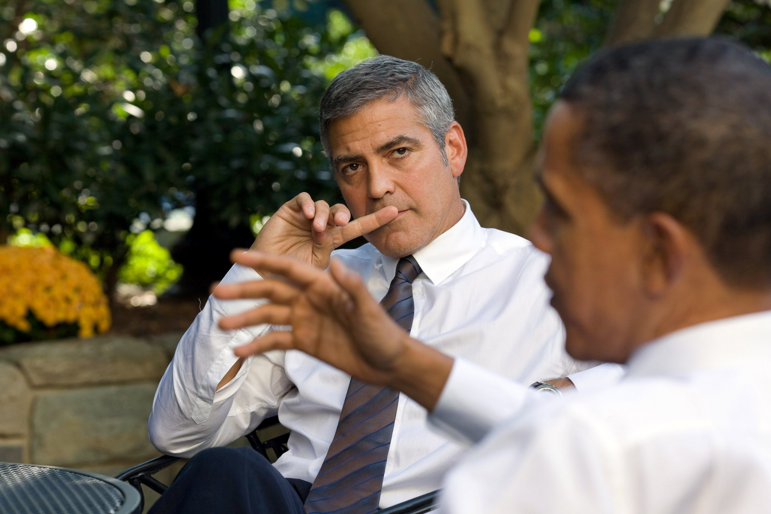 PHOTO: Barack Obama, right, talks about Sudan with actor George Clooney, left, during a meeting outside the Oval Office on Oct. 12, 2010 in Washington, D.C. 