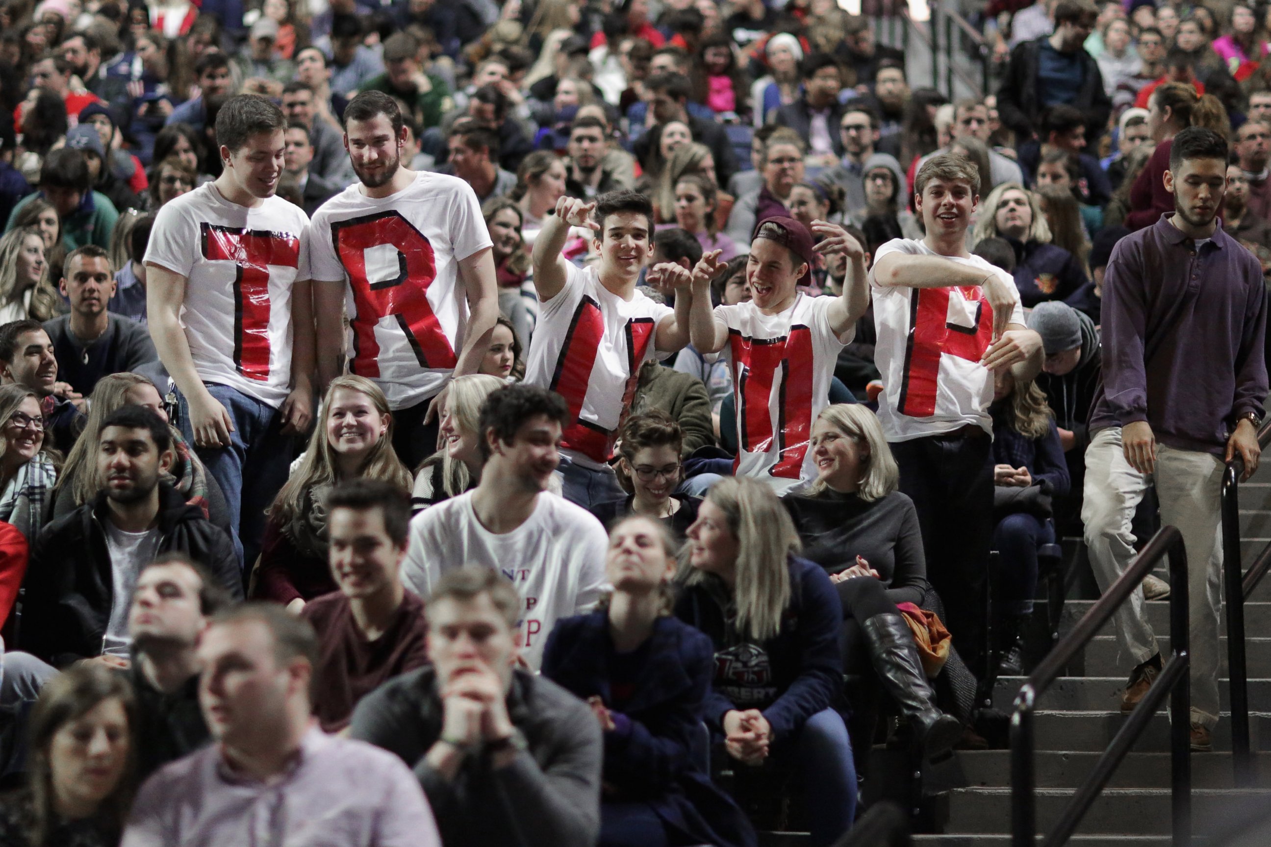 PHOTO: Liberty University students wear home made t-shirts spelling 'TRUMP' while waiting for the arrival of Republican presidential candidate Donald Trump during a campaign rally, Jan. 18, 2016 in Lynchburg, Virginia. 