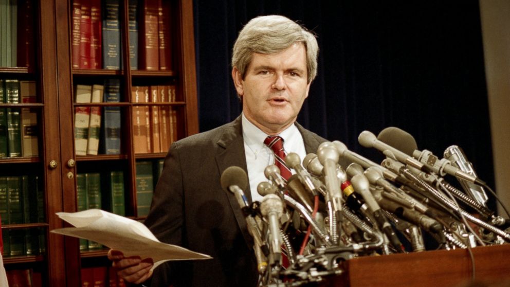 PHOTO: Rep. Newt Gingrich (R, GA) holds a copy of the allegations of possible misconduct by House Speaker Jim Wright of TX during a press conference in DC, 1988.
