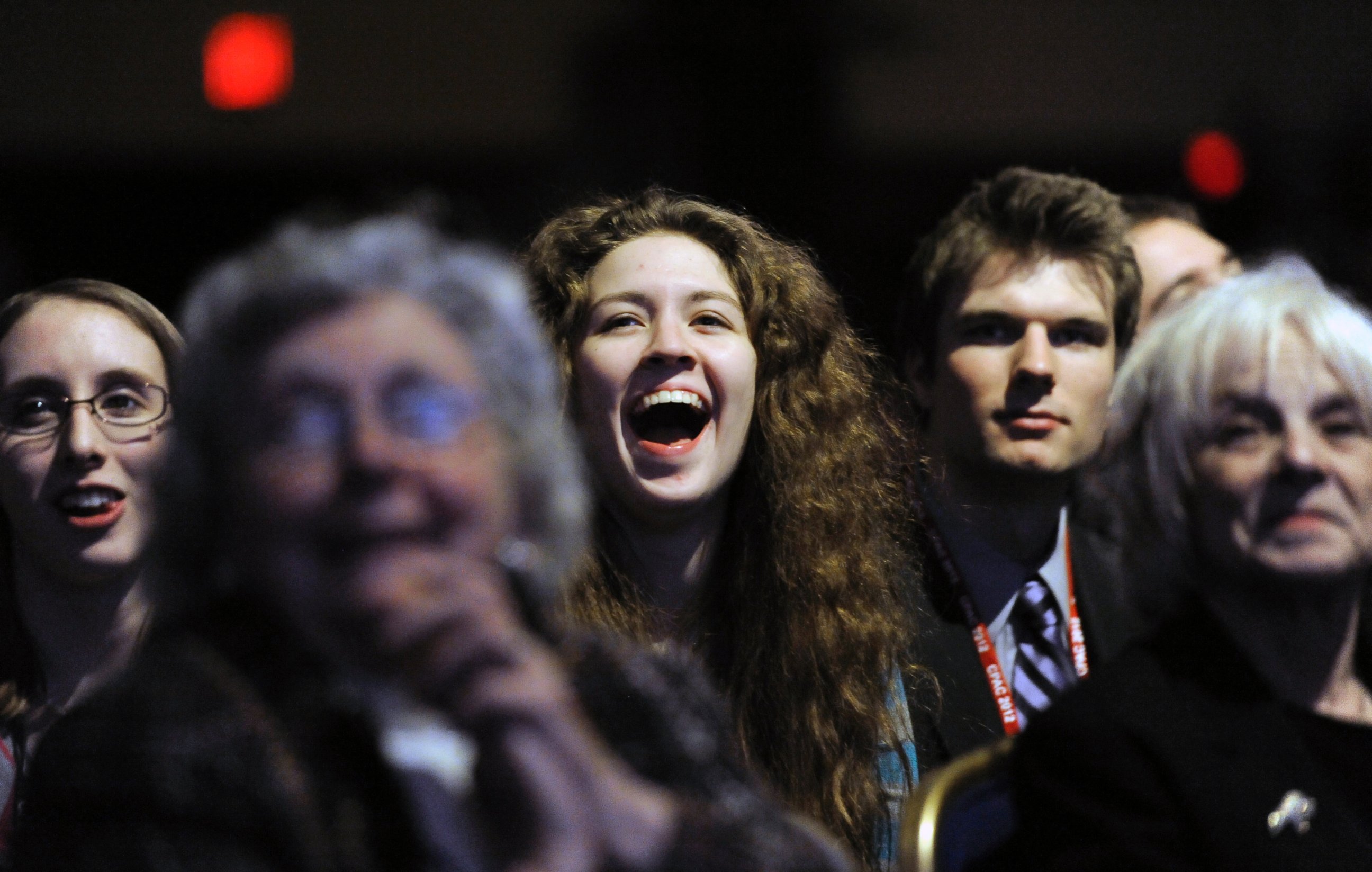 PHOTO: An audience with conservative ideals listens and cheer for Herman Cain at the 39th Annual CPAC Conference in Washington, Feb. 9, 2012.